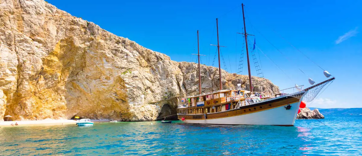 Vintage sailing boat anchored in an idyllic bay on Krk island in Croatia