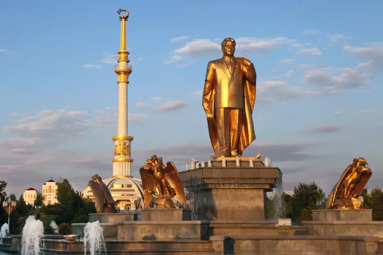 Monumen of Niyazov and Arch of Independence in sunset, Ashkhabad, Turkmenistan