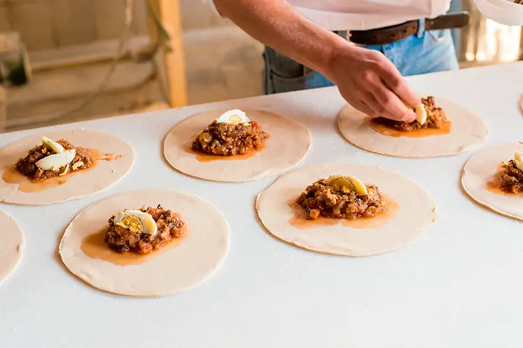 Empanada Preparation at a Chilean Bakery