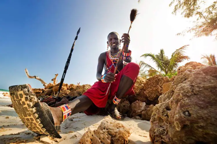 Maasai by the ocean on the beach