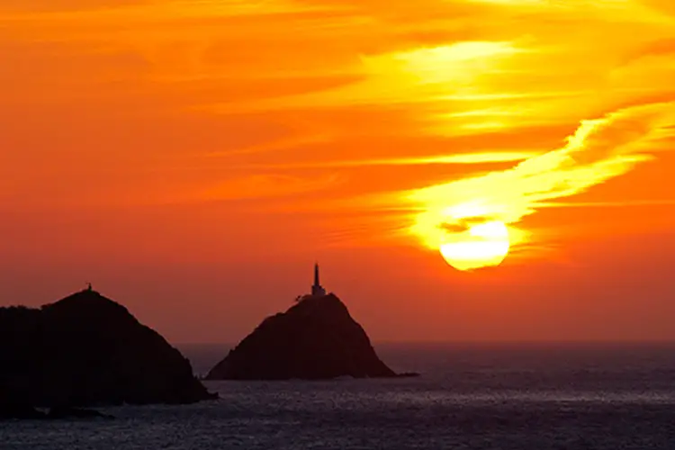 Lighthouse at sunset, Caribbean coast of Taganga, Colombia