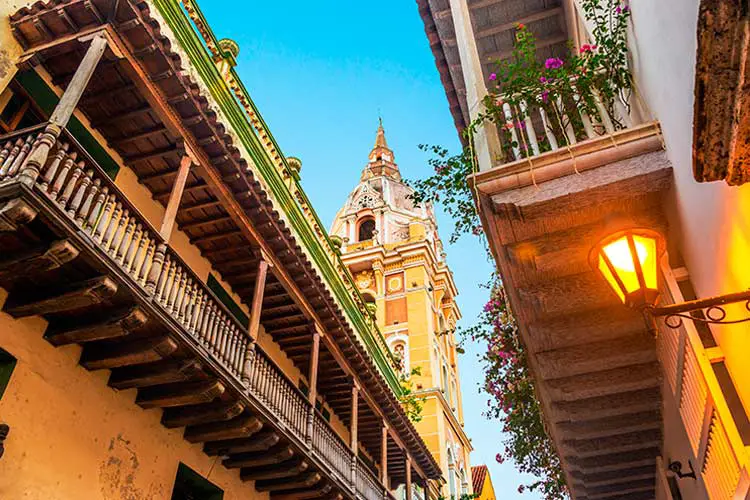 historic colonial balconies and a church in Cartagena, Colombia