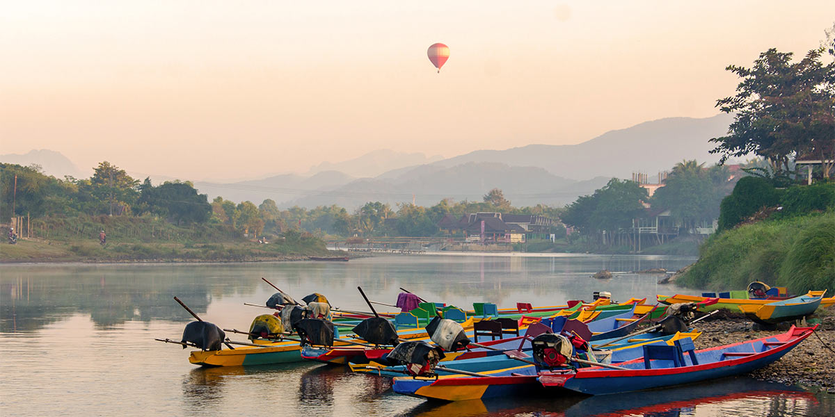Long tail boats on Song river, Vang Vieng, Laos