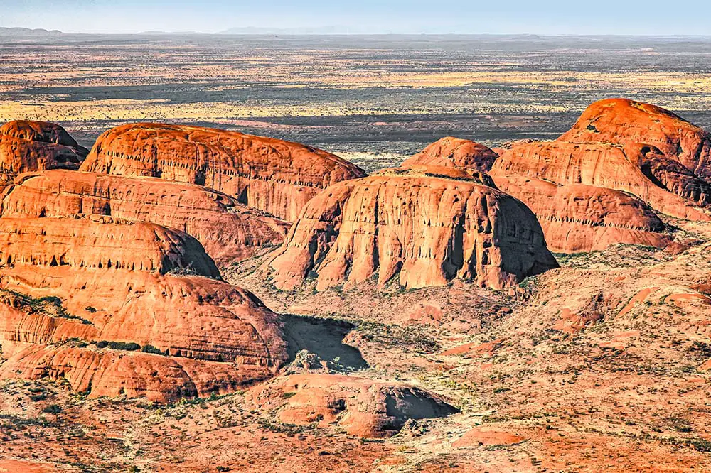 Helicopter flight over the Kata Tjuṯas in the Uluṟu Kata Tjuṯa National Park, Northern Territory, Australia